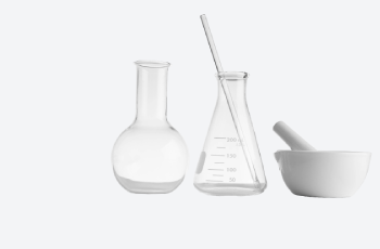 High-Quality Laboratory Supplies for Every Need A variety of laboratory supplies including glass beakers, test tubes, and chemicals displayed on a workbench.